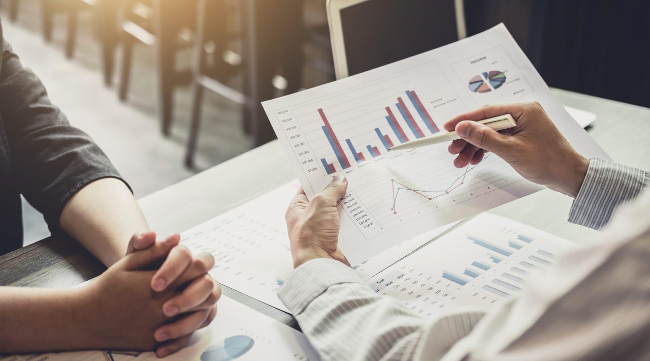 Co working conference, Business team meeting present, investor colleagues discussing new plan financial graph data on office.
